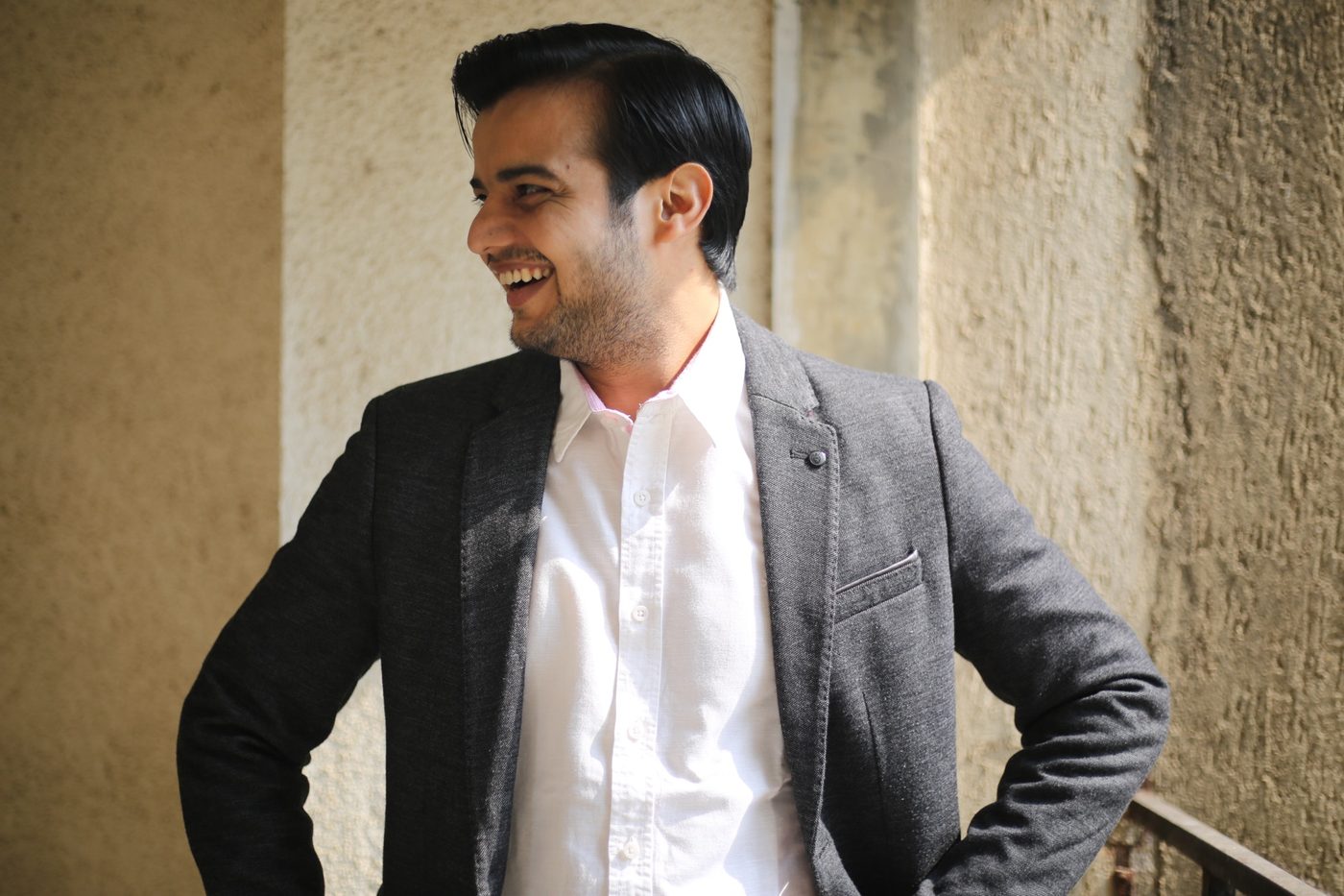 Mayank Pandey, producer and storyteller, smiling in a grey blazer